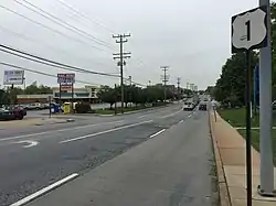 View north along 3400 block of Wilkens Avenue in Baltimore, with commercial buildings in Saint Agnes to the left