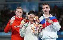Floor exercise victory ceremony (from left to right): Krisztián Balázs (Silver), Takeru Kitazono (Gold), Sergei Naidin (Bronze)