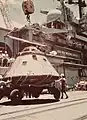 A crane lowers the Apollo CSM-111 capsule at Pearl Harbor from USS New Orleans on 25 July 1975.