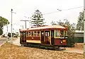 Type C ("Desert Gold" or "Bouncing Billie") tram no.&nbsp;186, built 1919, leaves Shell Street, St Kilda