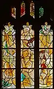 Window 11, resurrection, small angel, green bird, four candles at top
