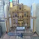 The original sanctuary of the church before the bombing in 1945. The diorama depicts the visit of the young Jose Rizal with his father Francisco Rizal Mercado in 6 June 1868.
