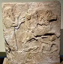 Assyrian scribe documenting a battle scene (9th-7th century BCE)