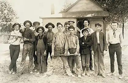 Image 9Photograph of glassworkers by Lewis HinePhotograph: Lewis Hine; restoration: Lise BroerA baseball team composed mostly of child laborers from an Indiana glassmaking factory, as photographed by Lewis Hine in August 1908. Hine (1874–1940) was an American sociologist who promoted the use of photography as an educational medium and means for social change. Beginning in 1908, he spent ten years photographing child labor for the National Child Labor Committee. The project was a dangerous one, and Hine had to disguise himself – at times as a fire inspector, post card vendor, Bible salesman or industrial photographer – to avoid the factory police and foremen.More featured pictures