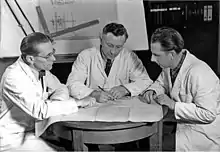 Image 19Engineers conferring on prototype design, 1954 (from Engineer)