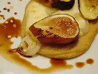 A fig and shallot pizzetta with balsamic vinegar