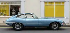 Front-engine, rear-wheel drive coupe: 1964 Jaguar E-Type. Automotive designers call the position of the driver's hip close to the rear axle "close-coupled".