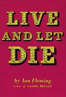 A book cover, in deep red. In large yellow / gold stylised type are the words "Live And Let Die". Underneath, in smaller type "by Ian Fleming, author of CASINO ROYALE".