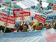 Image 54Union members march in Argentina on Human Rights Day in December 2005. The signs read "Worker rights are human rights..