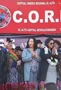 Mireya Montaño claps her hands while attending a parade.