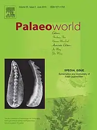 Green cover with the journal title in red sans-serif type. Below the title are a list of editors and a greyscale photo of the well-preserved spine of a small animal. Images of fossils appear faintly in the background: The skull of a Tyrannosaurus rex, a trilobite, and a leafy plant.