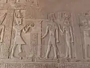 A Ptolemaic dynasty ruler with the cartouche "Ptolemy" before Sobek and Hathor, Kom Ombo.
