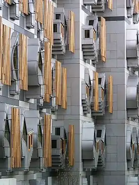 Image 14The Scottish Parliament Building (Scottish Gaelic: Pàrlamaid na h-Alba, Scots: Scots Pairlament Biggin) is the home of the Scottish Parliament at Holyrood, within the UNESCO World Heritage Site in central Edinburgh. It was designed by Enric Miralles, the Catalan architect,.and has won a number of awards, including an award at the VIII Biennial of Spanish Architecture, the RIAS Andrew Doolan Award for Architecture, and the 2005 Stirling Prize, the UK's most prestigious architecture award.Photo credit: Wangi