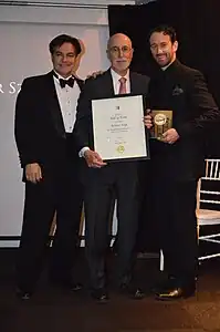 Irvin Ungar (center) accepting the Society of Illustrators' Hall of Fame award on behalf of artist Arthur Szyk in 2015