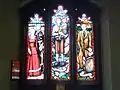 Stained glass west window depicting Pauline and Georges Vanier, Gianna Beretta Molla and Franz Jägerstätter