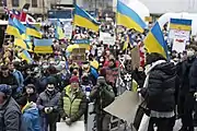 An anti-war protests in Vancouver with dozens of Ukrainian flags.