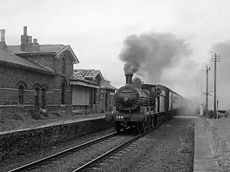 Steam train passing through Eglinton station on 1 September 1979