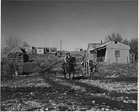 "Arroyo Seco. Note road, transportation by horse, typical structure of outbuildings," December 1941