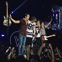 The Vamps performing at the O2 Arena in London during their Wake Up World Tour, in April 2016.(L-R: James Brittain-McVey, Tristan Evans, Connor Ball and Brad Simpson)