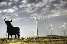 Image 41Wind turbines are typically installed in windy locations. In the image, wind power generators in Spain, near an Osborne bull. (from Wind power)