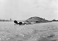 USS Oklahoma overturned, 7 December 1941.