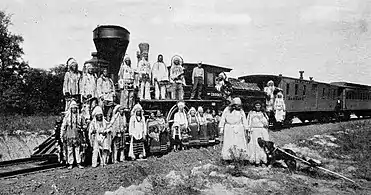 Postcard photo of the William Crooks with members of the Blackfoot tribe. The photo was taken at the Fair of the Iron Horse in Baltimore, MD, in 1927.