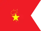 A gold star placed on top of a red torch with a flame, outlined in gold. This is placed on a red background, where the right edge has a triangle section cut out.