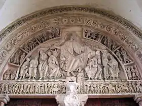 The tympanum of the inner portal of la Madeleine Vezelay has the scene of Christ in Majesty, at the Last Judgement. The figure of Christ is highly formalised in both posture and treatment. (1130s)