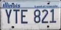 Illinois license plate design used throughout the 1980s and 1990s, displaying the Land of Lincoln slogan that has been featured on the state's plates since 1954