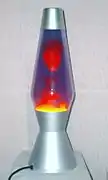 D. Lava lamp with interaction between dissimilar liquids: water and liquid wax