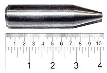 Shiny metallic cylinder with a sharpened tip. The overall length is 9 cm and diameter about 2 cm.