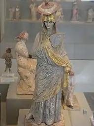 Greek statue of a woman with blue and gilt garment from Tanagra, 325–300 BC, gilt and painted terracotta, Antikensammlung Berlin, Berlin, Germany