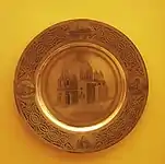 A silver plate depicting the cathedral displayed at the American Museum of Natural History