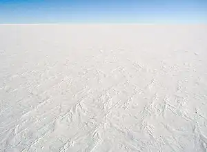 aerial view of ice sheet covered in snow Antarctica