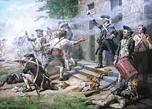 A close up of Continental infantry fighting in a street; a company on line firing to the left off the painting; in the center the officer; right foreground a drummer boy and behind him a soldier reloading a musket.