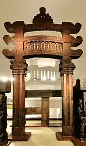 Eastern gateway of Bharhut stupa topped with a dharmachakra pinnacle