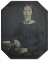 Photograph of Emily Dickinson, seated, at the age of 16