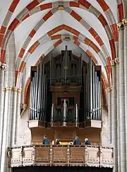 Photo of interior of the church with organ featured prominently