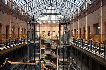 Interior of the Bradbury Building, with its exposed staircases and free-standing hydraulic elevators, Los Angeles, USA, by George Herbert Wyman, 1889-1893