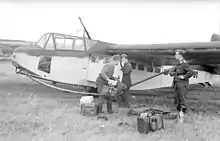a black and white photograph of a wide-bodied military glider