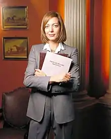 Allison Janney, pictured in costume as C.&nbsp;J. Cregg, for a promotional shoot