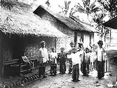 Young dancer accompanied by angklung players in Baduy, Banten. c. 1910-1930.