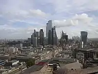 The City of London skyline as viewed from St Paul's Cathedral, October 2022. The tallest building shown here is 22 Bishopsgate at 278m, which topped out in 2019. Since its construction the famous "Gherkin" building is no longer visible from this angle. There are currently four towers in this cluster that are above 200m tall with three more approved to be constructed, 1 Undershaft at 290m tall, 55 Bishopsgate at 269m tall and 100 Leadenhall at 249m tall, by 2026. Also shown in the far distance on the left is the emerging cluster in Stratford