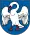 A coat of arms depicting a white bird with wings outspread, a red beak, and red feet all on a dark blue background