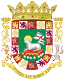 The Coat of arms of Puerto Rico features the Lamb of God and other symbols including the Kingdom of Jerusalem Cross and the Catholic Monarchs initials.