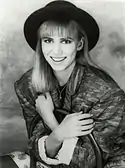 Debbie Gibson smiling towards the camera.
