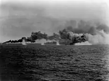 Escort ships of Taffy 3 laying smoke while under fire, 25 October 1944