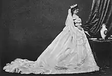 Elisabeth in her coronation Dress Looking Over her Shoulder looking down.