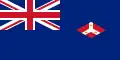 A British Blue Ensign (a blue flag with the Union Jack placed at the top left corner) charged with the badge of the Straits Settlements (red diamond with an inverted white Y; inside that inverted Y is three crowns.