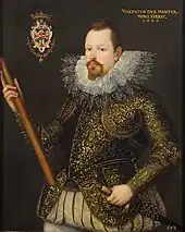  Artist's representation of a man with pointed beard, heavy ruff collar and embroidered jacket, holding a staff in his right hand and a sword in his left. A badge or coat of arms is shown top left, and a legend: "Vincentius Dux Mantua, Mont Ferrat 1600" is visible top left.